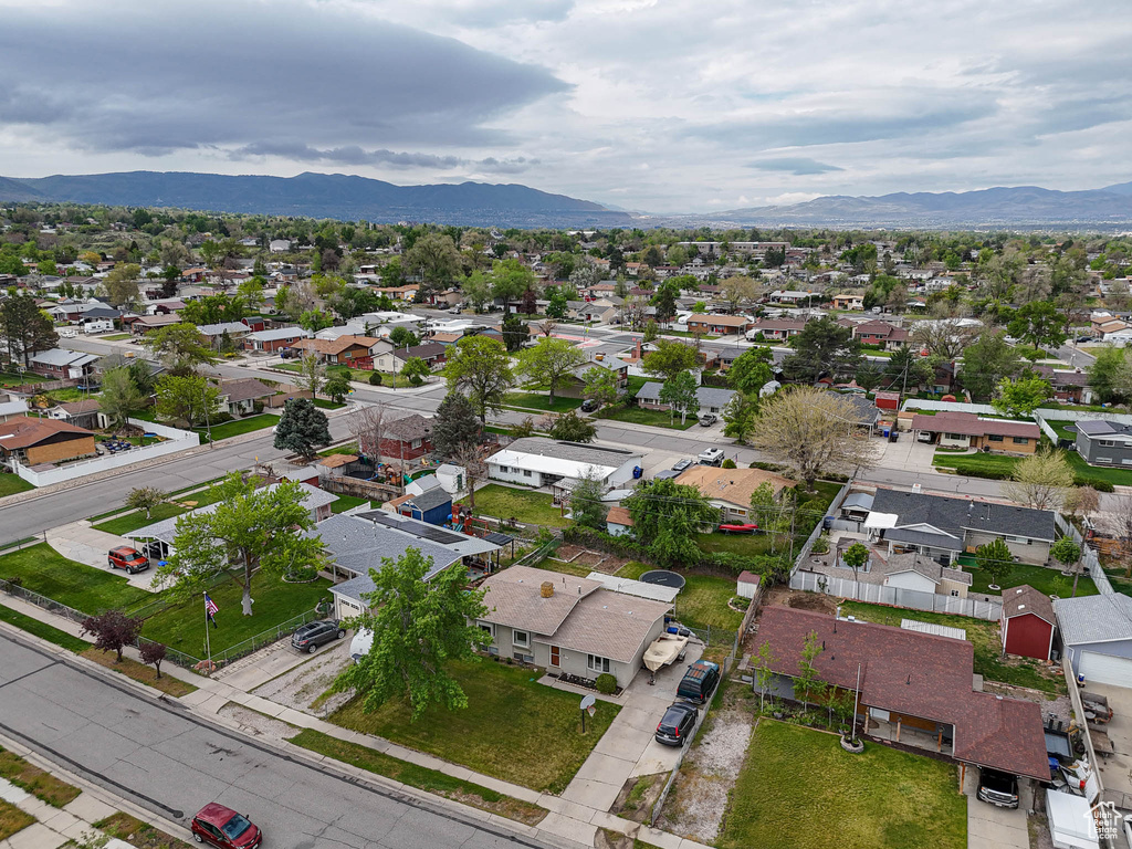 Aerial view of residential area featuring a mountain backdrop