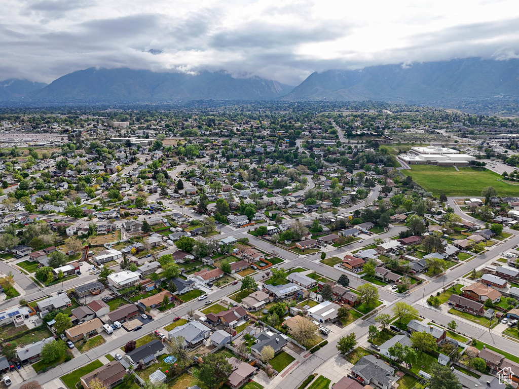 Aerial view of property and surrounding area with mountains