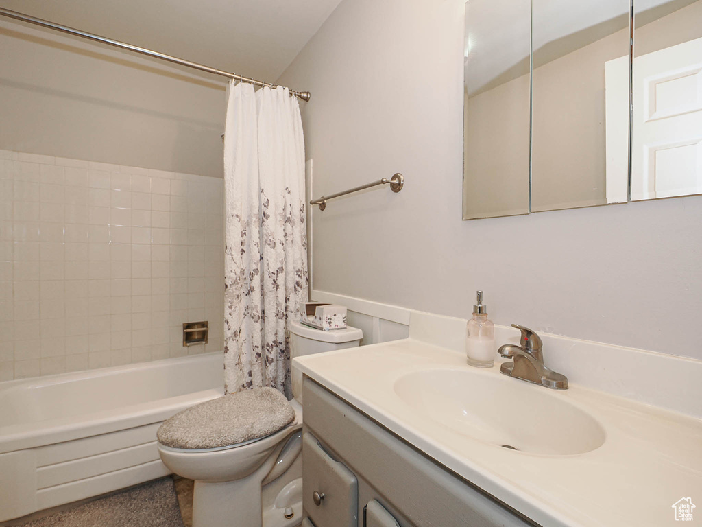 Full bath featuring toilet, shower / tub combo, and vanity