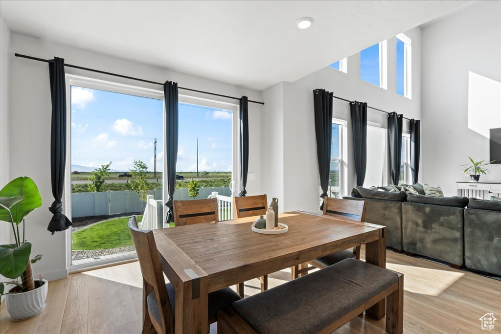 Dining area featuring light wood-style floors and recessed lighting