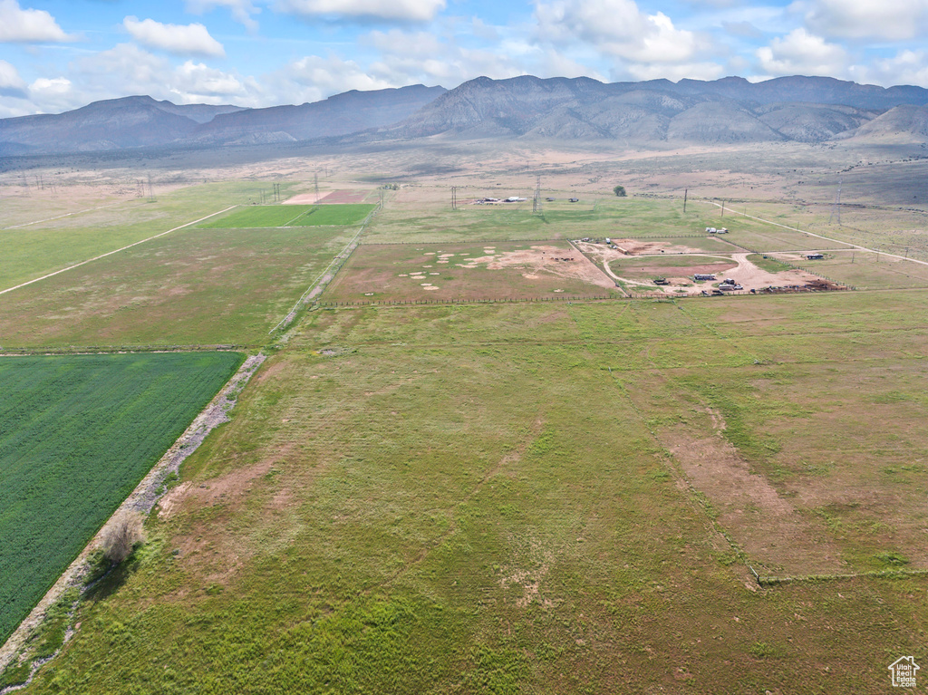 Aerial view of sparsely populated area with a mountain backdrop