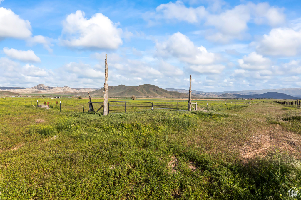 View of mountain backdrop featuring rural landscape and agricultural land
