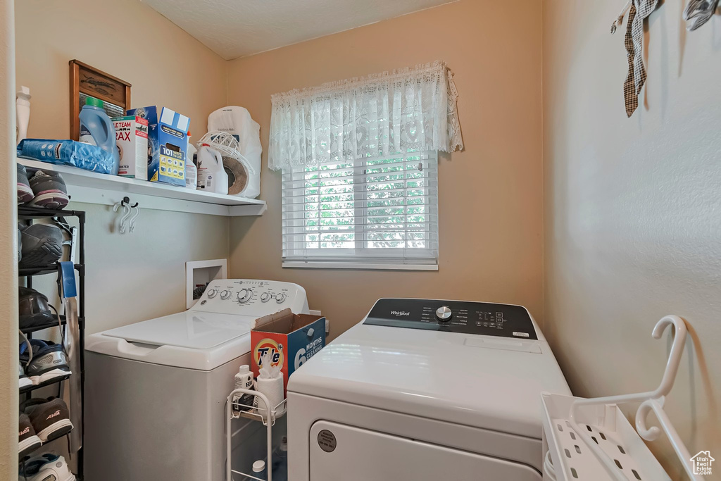 Laundry area featuring independent washer and dryer