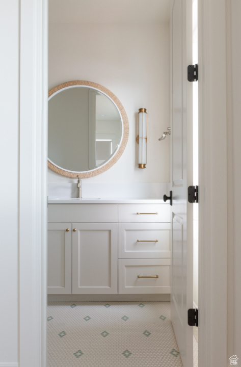 Bathroom with vanity and tile patterned floors