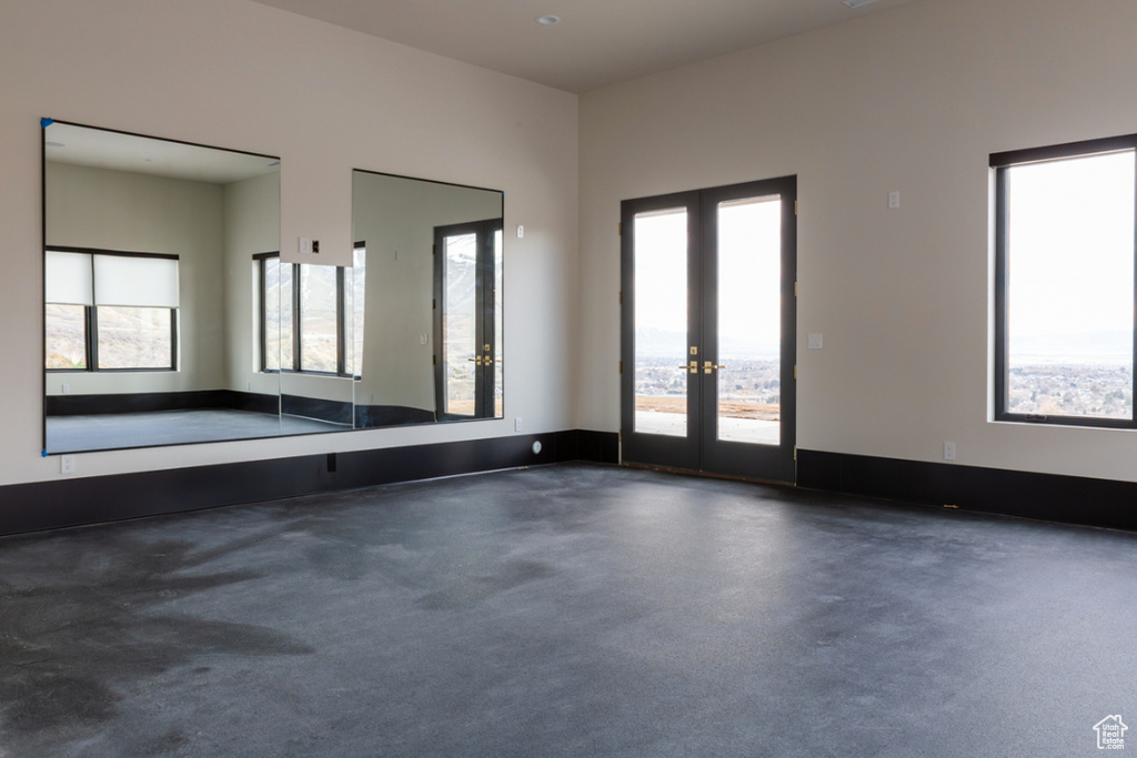 Unfurnished room with french doors