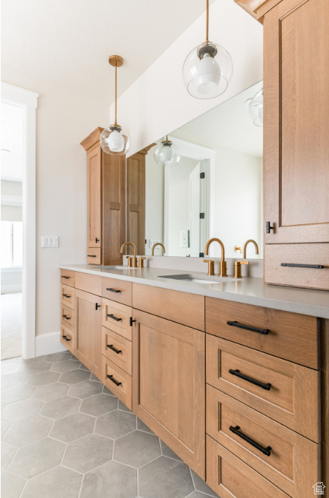 Bathroom featuring vanity and tile patterned floors