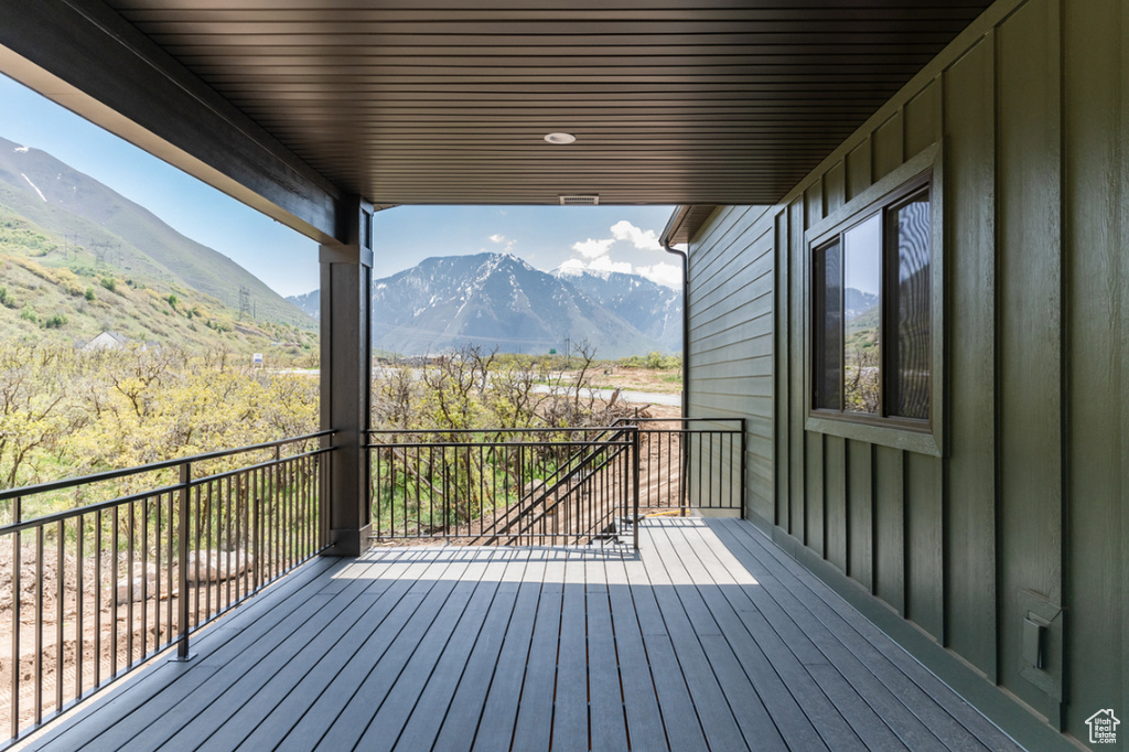Wooden terrace featuring a mountain view