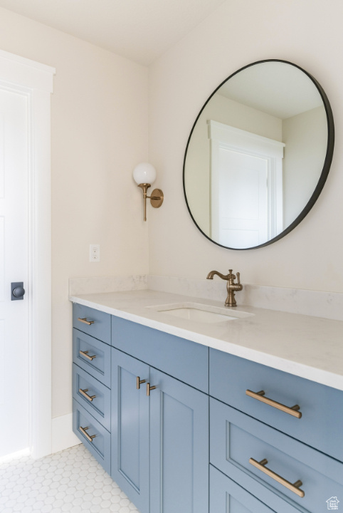 Bathroom featuring vanity and baseboards