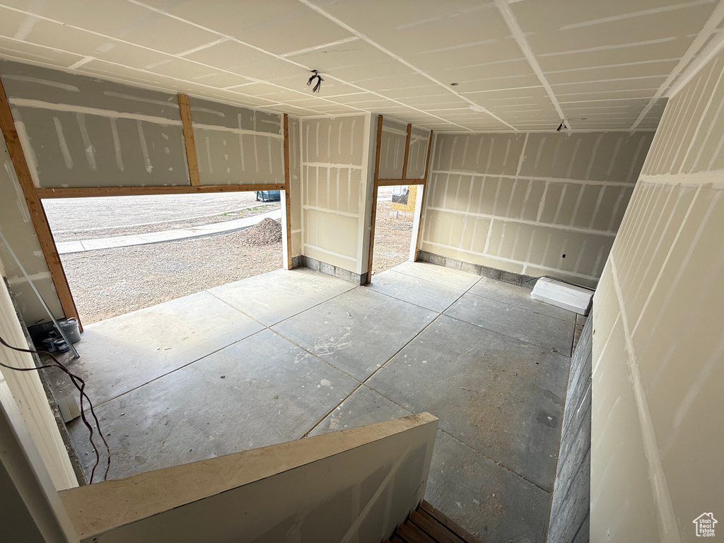 Spare room featuring concrete flooring