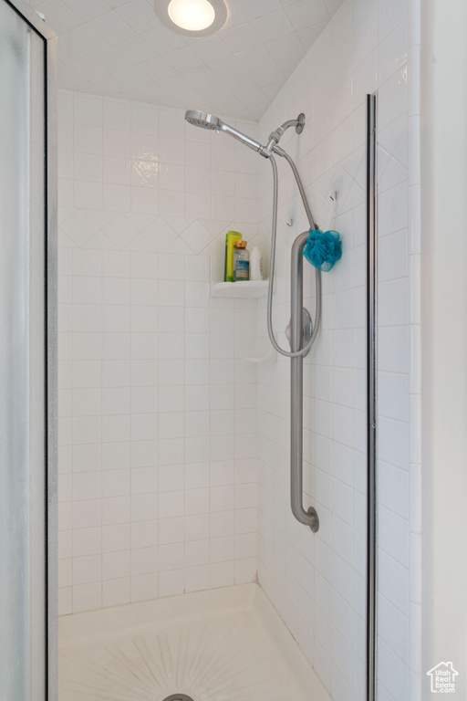 Bathroom featuring a shower stall