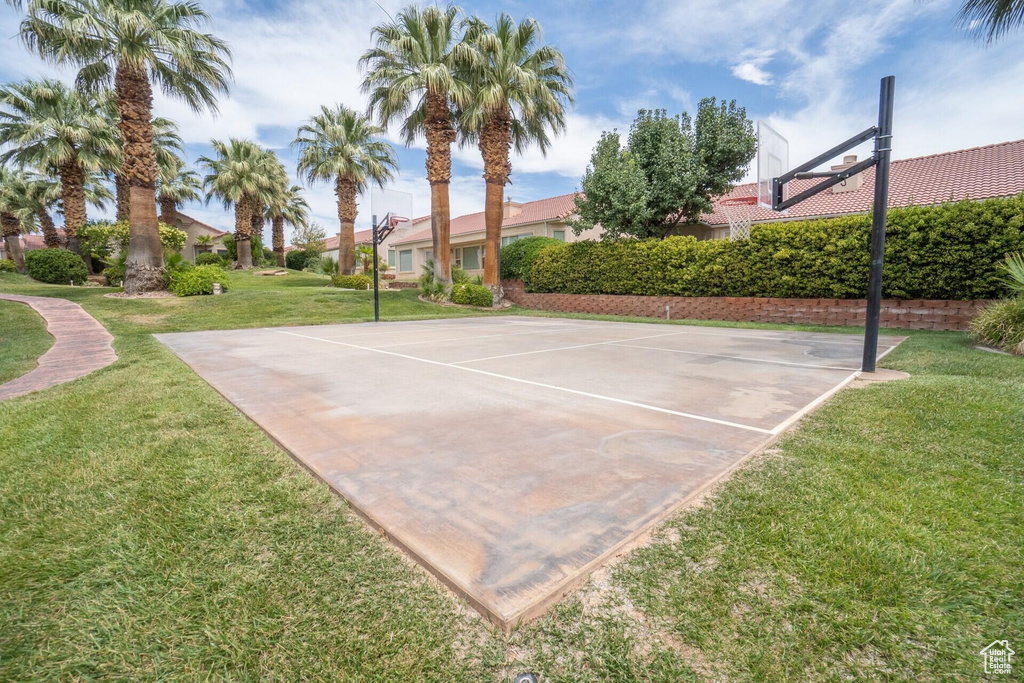 View of sport court with community basketball court and a lawn