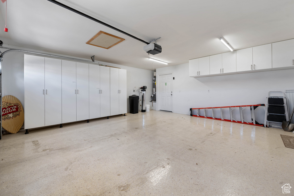 Garage featuring a garage door opener
