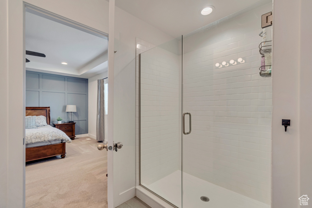 Bathroom with a shower stall, connected bathroom, recessed lighting, and baseboards