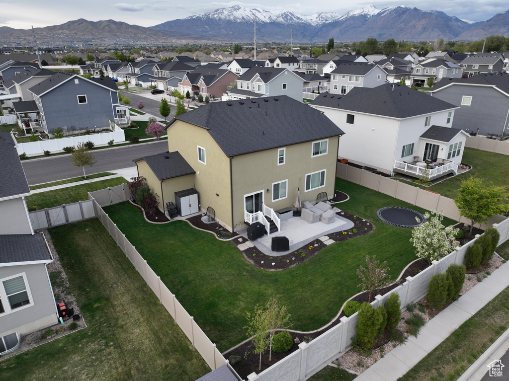 Aerial view of residential area with a mountain backdrop