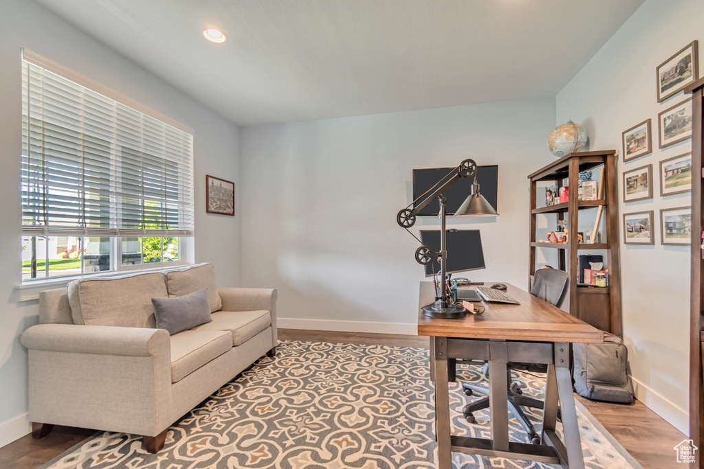 Office space with wood finished floors, baseboards, and recessed lighting