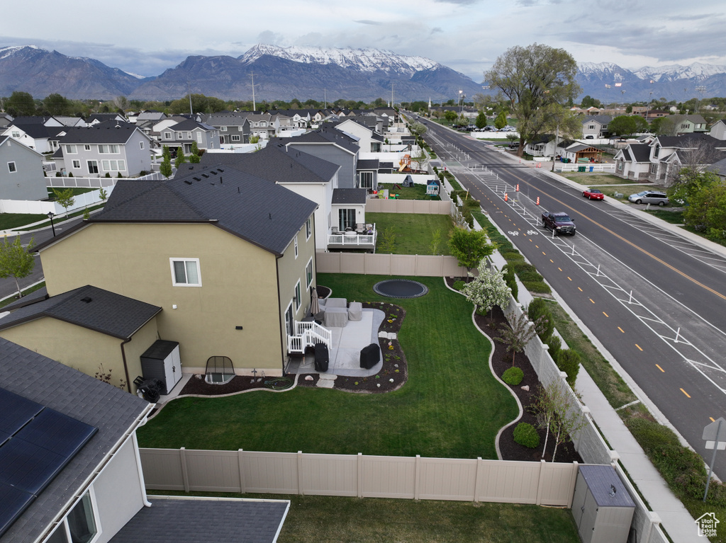 Aerial perspective of suburban area featuring a mountainous background