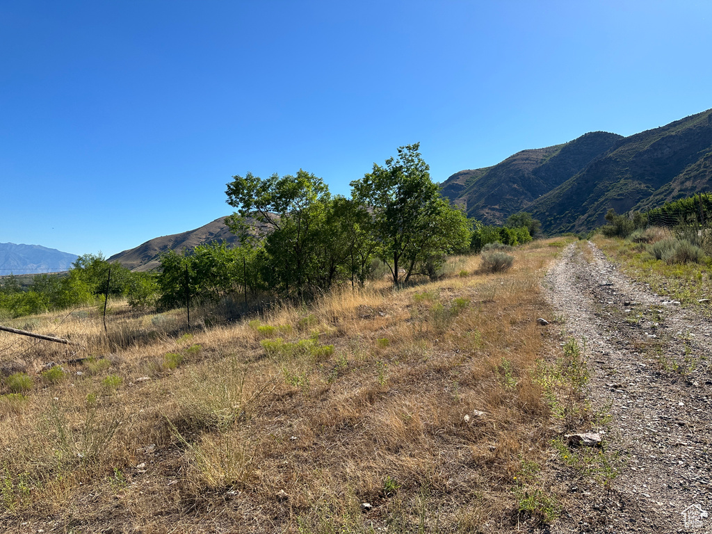 View of mountain backdrop with rural landscape