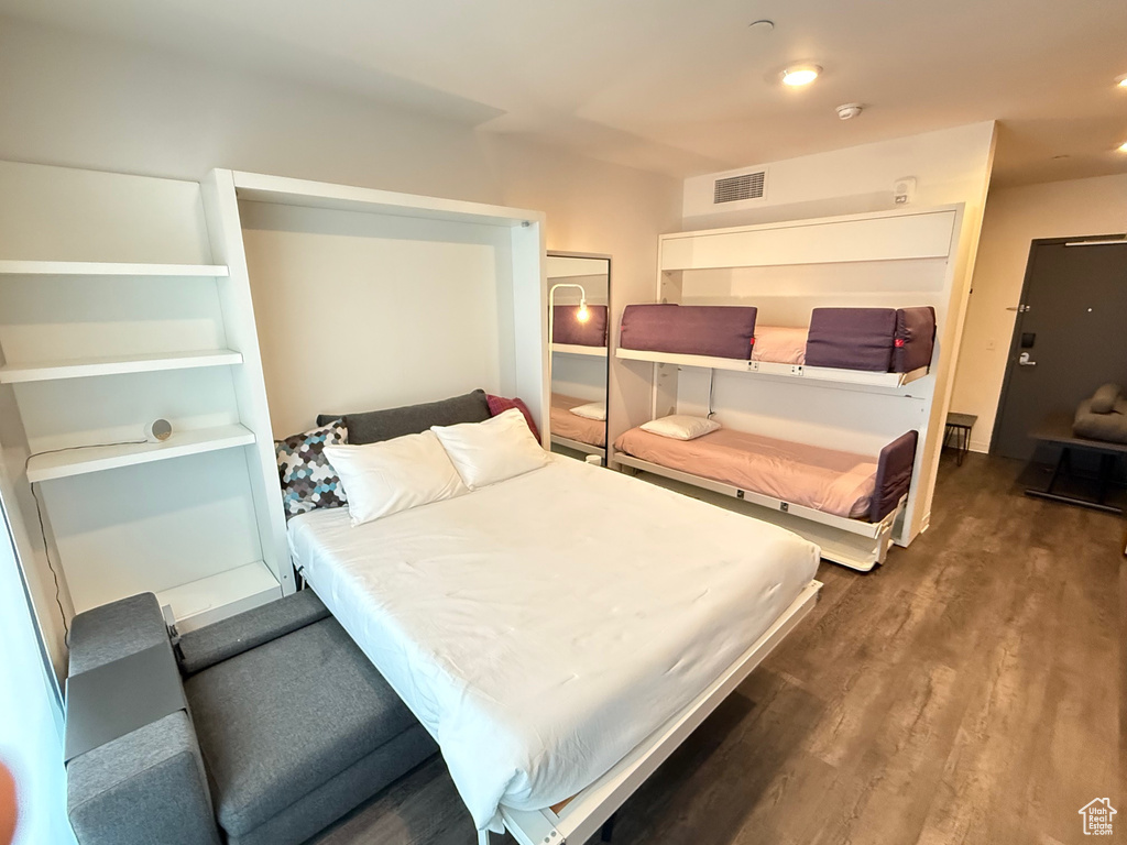 Bedroom with wood finished floors