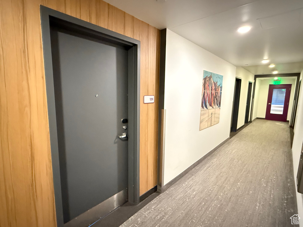 Corridor featuring baseboards