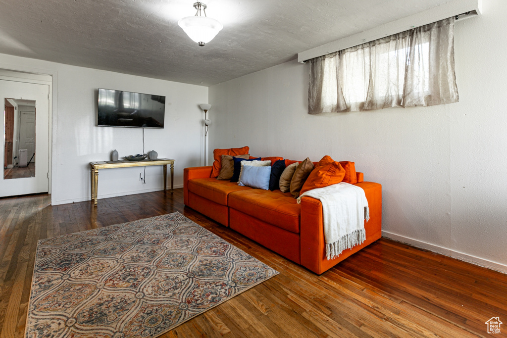Living room with wood finished floors and baseboards