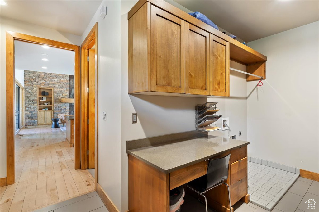 Home office featuring baseboards, recessed lighting, and light tile patterned floors
