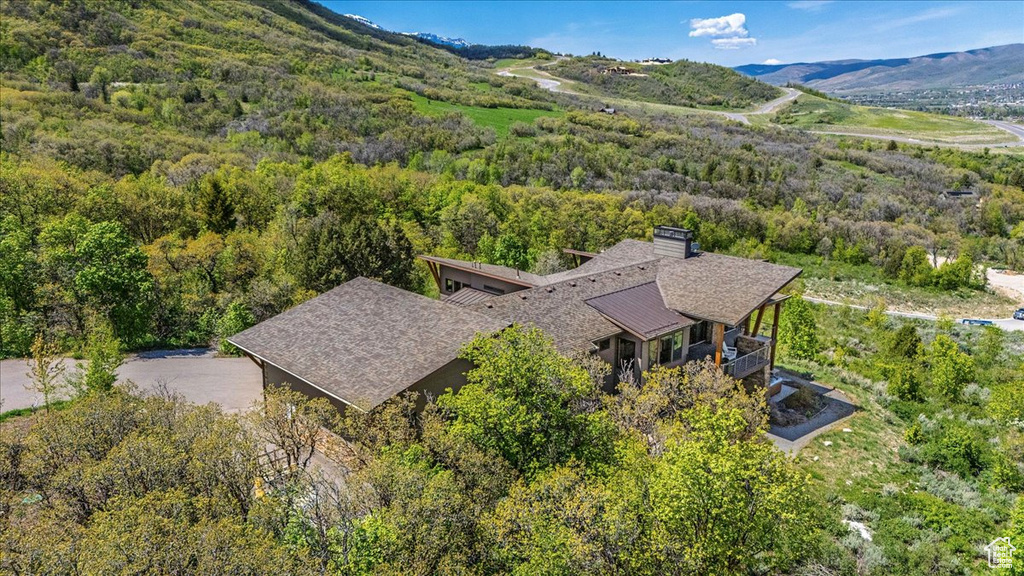 View from above of property featuring a forest