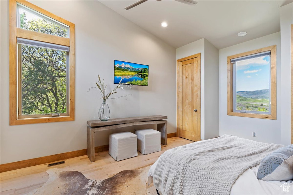 Bedroom with baseboards, wood finished floors, recessed lighting, and a ceiling fan