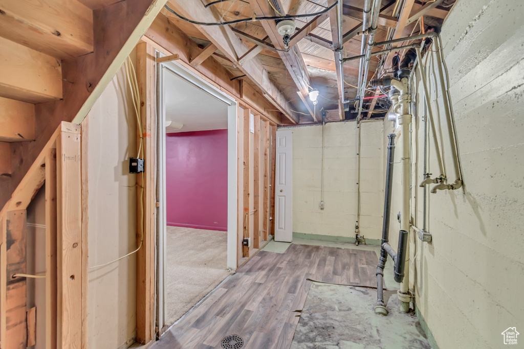 Hallway featuring wood finished floors