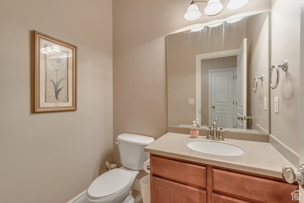 Half bath with toilet and vanity