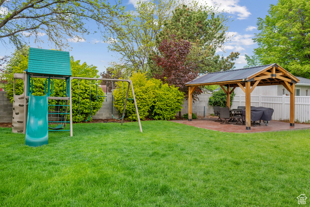 View of yard with a gazebo, a playground, and a patio