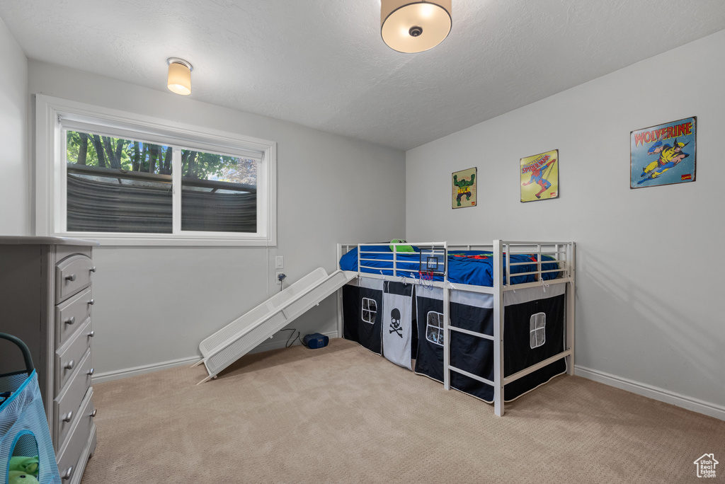 Carpeted bedroom with baseboards