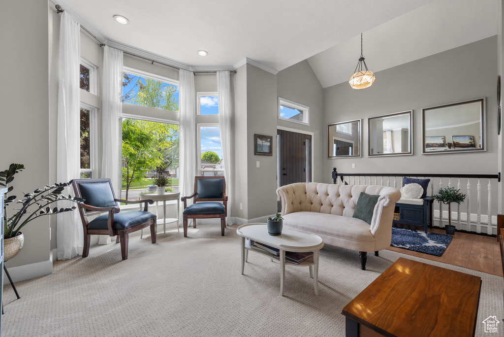 Living room with high vaulted ceiling, baseboards, and recessed lighting