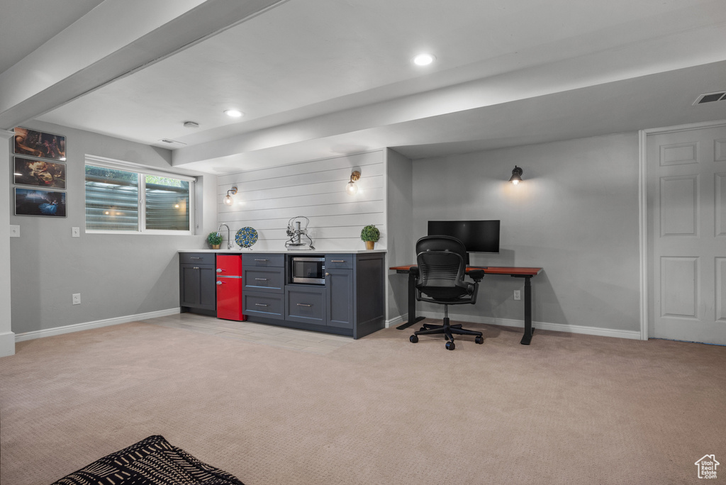 Office space with light colored carpet, baseboards, recessed lighting, and bar