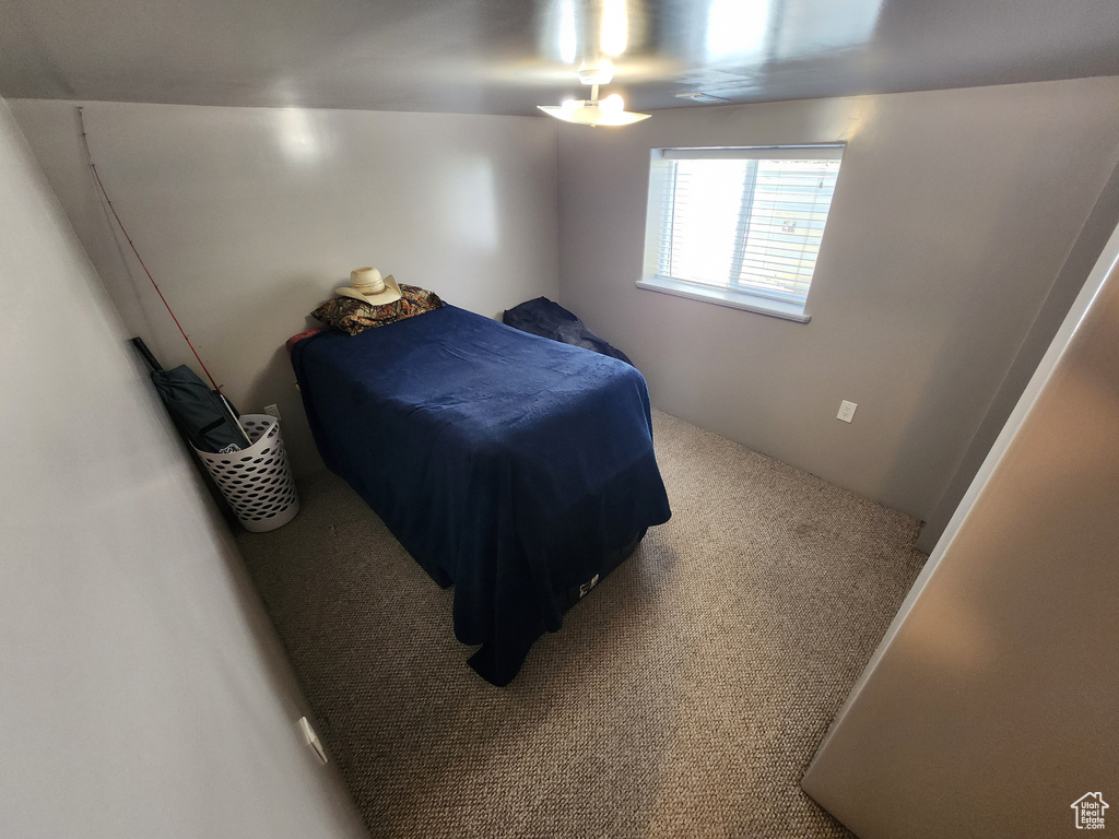 Bedroom with carpet and ceiling fan