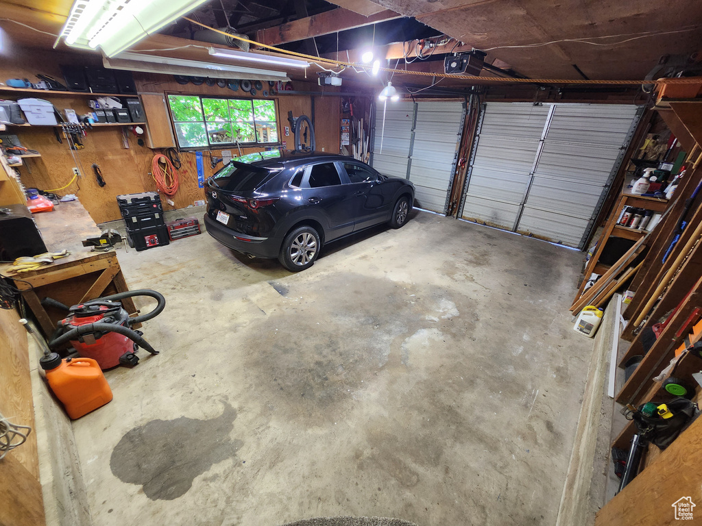 Garage featuring a garage door opener