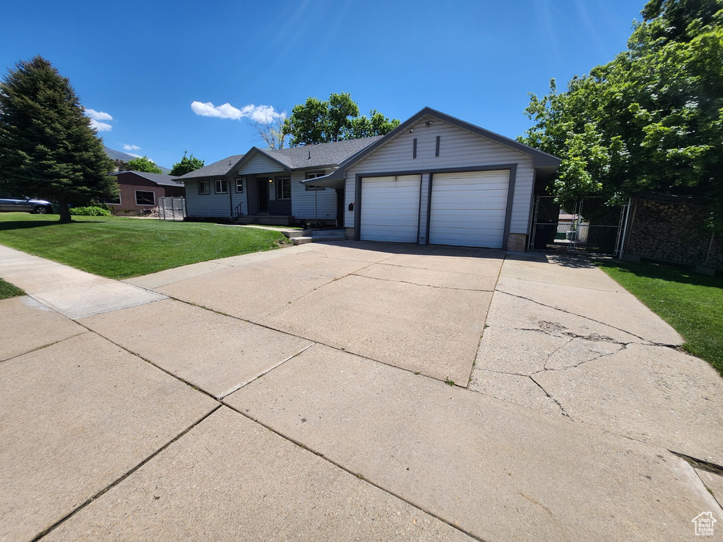 Single story home with a garage and driveway