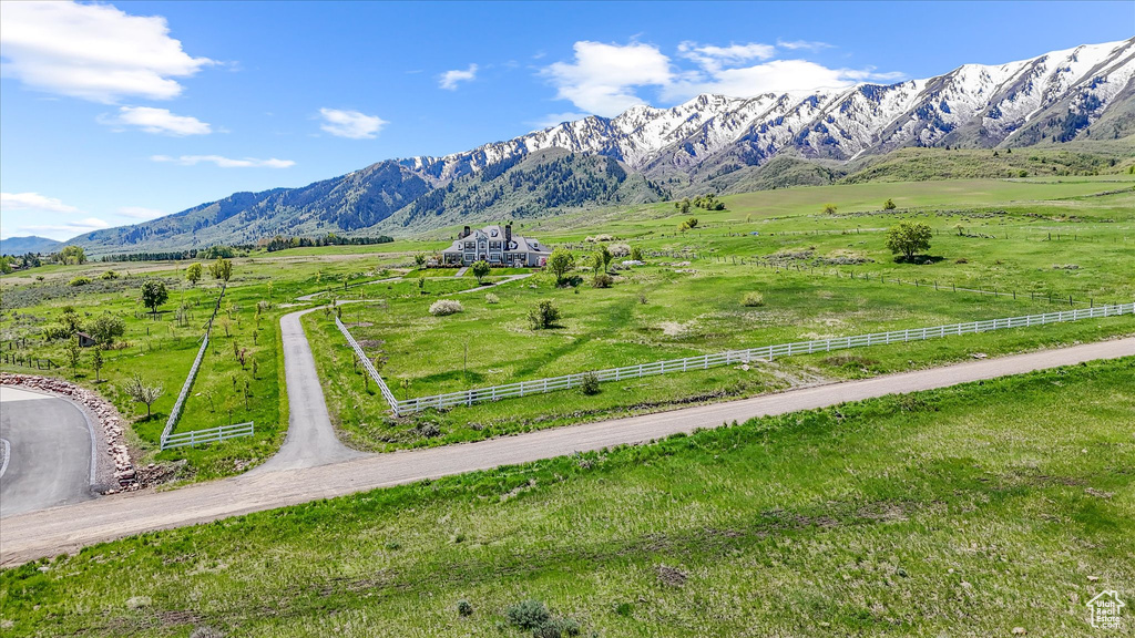 View of mountain backdrop with rural landscape and a pastoral area