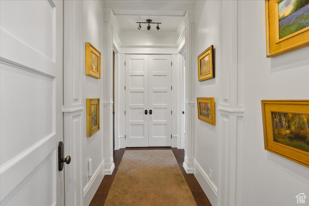 Hallway with a decorative wall