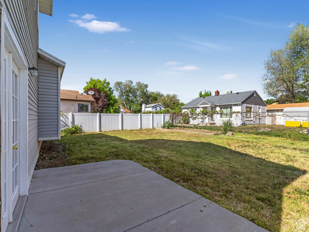 View of yard with a patio area