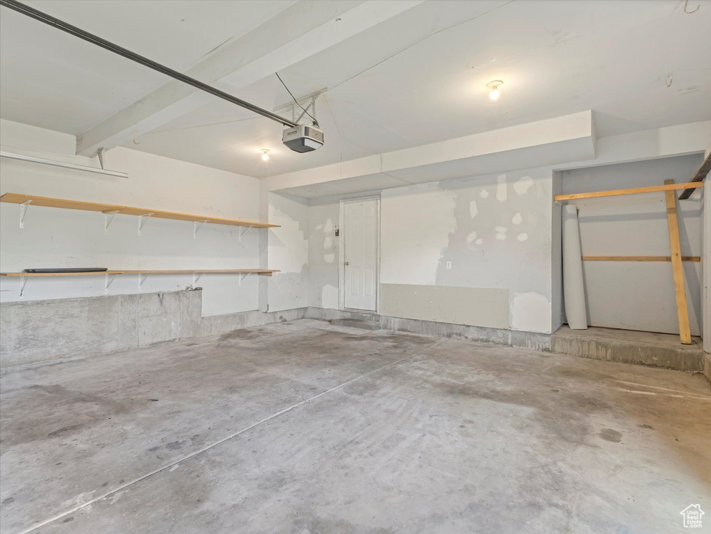 Garage featuring a garage door opener