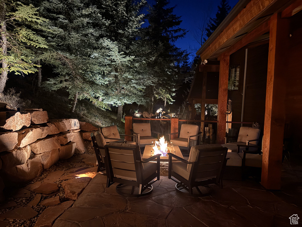 Patio at night with an outdoor fire pit