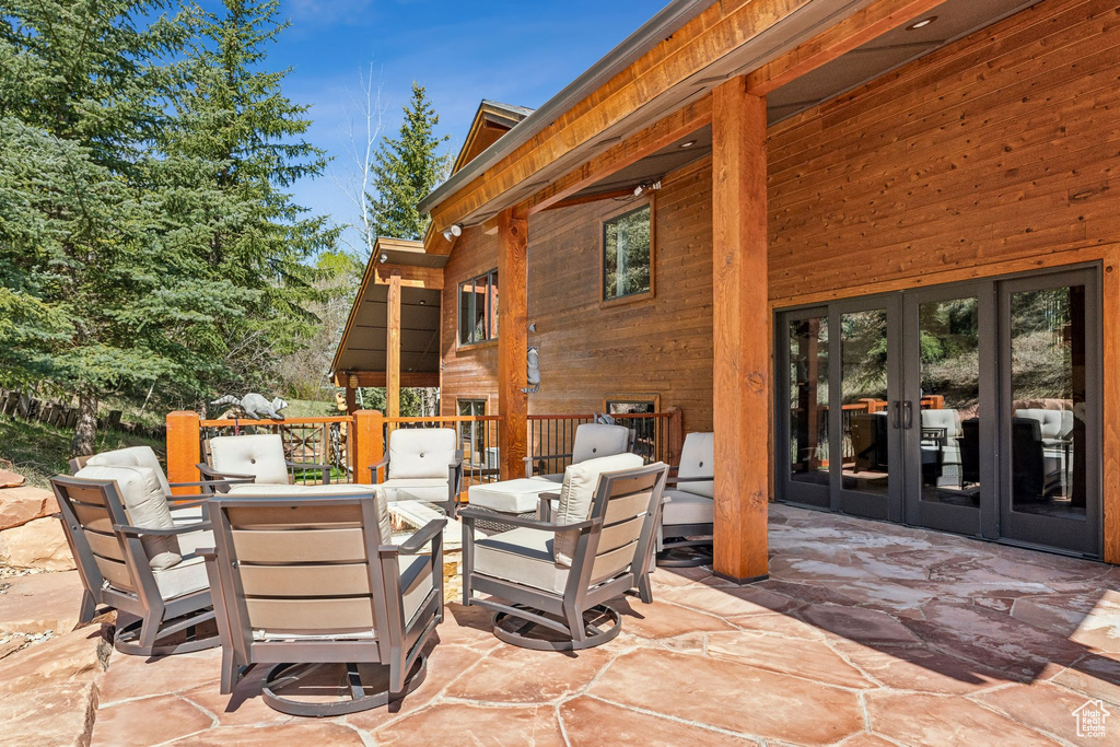 View of patio with french doors and outdoor lounge area