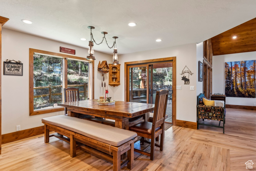 Dining area featuring recessed lighting, baseboards, plenty of natural light, and light wood-style flooring