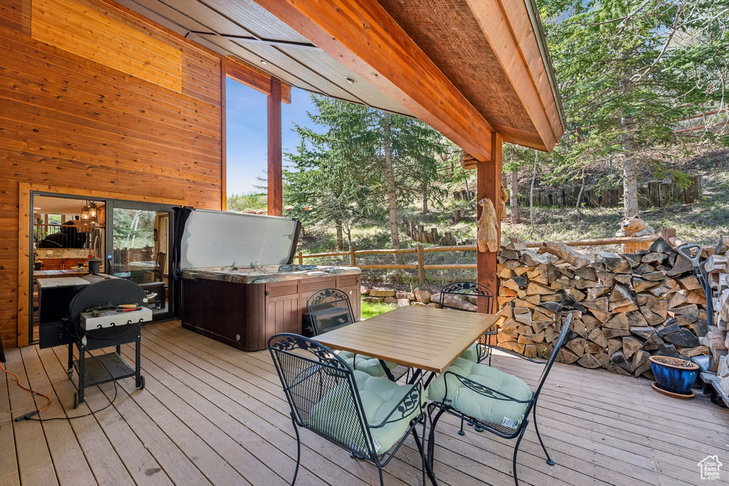 Deck featuring an outdoor kitchen and outdoor dining area
