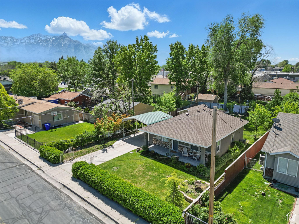Aerial view of residential area featuring a mountain backdrop