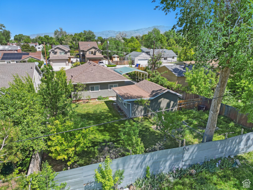 Aerial perspective of suburban area with a mountainous background