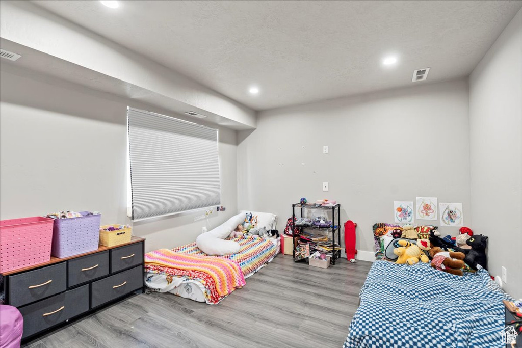 Bedroom featuring recessed lighting and light wood-style floors
