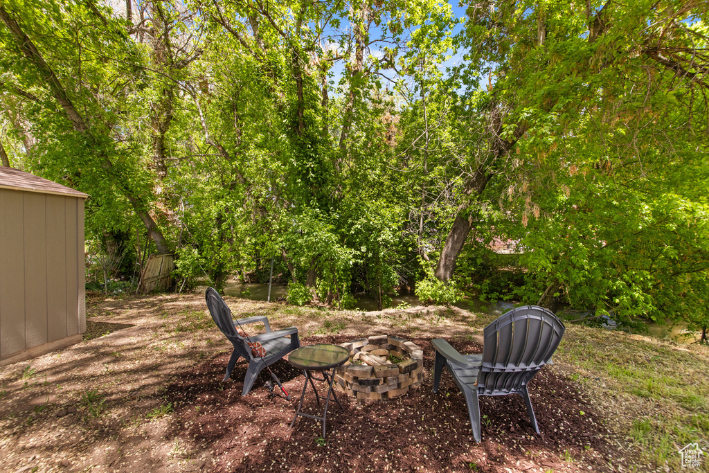View of yard with a fire pit