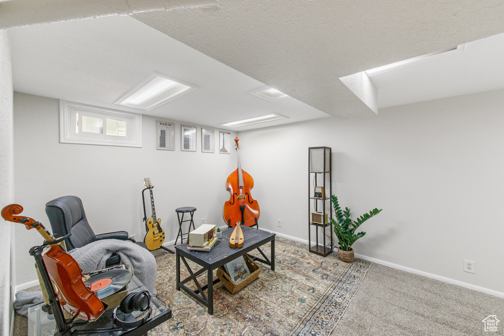 Sitting room with carpet flooring and baseboards