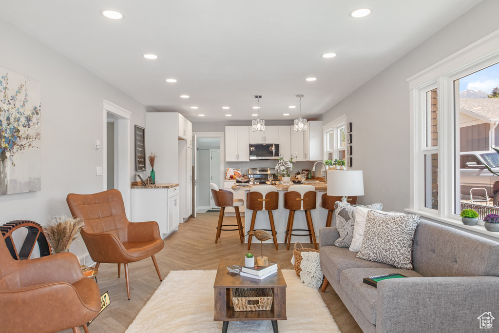 Living room featuring healthy amount of natural light and recessed lighting